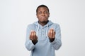 african man showing italian gesture that means what do you want over white background