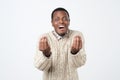 African man showing italian gesture that means what do you want over white background.