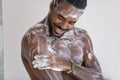 African Man Takes A Shower Washes His Body With Soap