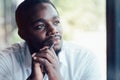 African man thinking and looking with holding a pen Royalty Free Stock Photo