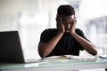 African man tired at his workplace in office Royalty Free Stock Photo