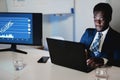 African man trader working inside hedge fund office - Focus on face