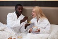 African man treats his wife with breakfast Royalty Free Stock Photo