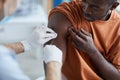 African Man Vaccinating against Covid Close Up