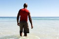 African man walking in to the sea water Royalty Free Stock Photo