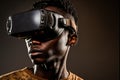 African man wearing virtual reality goggles standing studio clean background Royalty Free Stock Photo