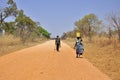African man and woman on dust african road