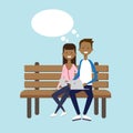 African man woman using laptop sitting wooden bench couple chat bubble character full length over blue background flat Royalty Free Stock Photo