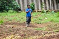 African Man working away in a small urban vegetable garden