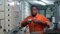 African marine engineer officer in engine control room ECR