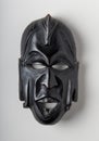 African mask carved in black painted wood Royalty Free Stock Photo