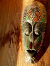 African mask on wood background Royalty Free Stock Photo