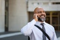 African mature businessman talking on phone outdoor Royalty Free Stock Photo