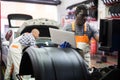 African mechanic man using a laptop computer checking car in workshop Royalty Free Stock Photo