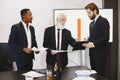 Three busines partners men in the office Royalty Free Stock Photo