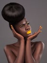 African, model and studio face with art, beauty and creative yellow lipstick. Bold, woman and skin with confidence