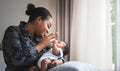 African mother feeding milk from bottle milk to her 2-month-old baby newborn son Royalty Free Stock Photo