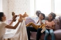 African mother holding puppet toys showing theatrical performance for family