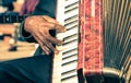 African musician hand playing fisarmonica accordion Royalty Free Stock Photo