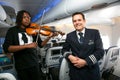 African Musician playing a violin on board a Airbus A380