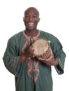 African musician with traditional clothes and drums