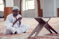 African Muslim Man Making Traditional Prayer To God While Wearing Dishdasha Royalty Free Stock Photo