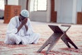 African Muslim Man Making Traditional Prayer To God While Wearing Dishdasha