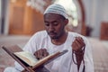 African Muslim Man Making Traditional Prayer To God While Wearing Dishdasha