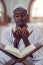 African Muslim Man Making Traditional Prayer To God While Wearing Dishdasha