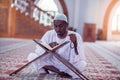 African Muslim Man Making Traditional Prayer To God While Wearing Dishdasha