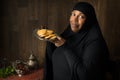 African muslim woman presenting cookies
