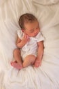 African newborn baby in white romper