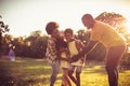 African parents playing with their children in nature