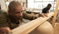 African potter checking the level of a bowl in a ceramics studio Royalty Free Stock Photo