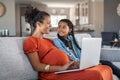 African pregnant woman working rom home in maternity leave Royalty Free Stock Photo