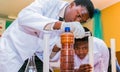African Primary School Students doing a science demonstration
