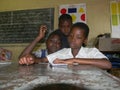 African primary schoolgirls using tablet.