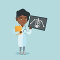 African roentgenologist examining a radiograph. Royalty Free Stock Photo