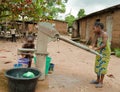 African rural girl child fetching water