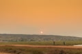 African rural people returning from work, with sunset. Sumbe. An