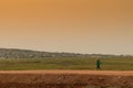 African rural people returning from work, with sunset. Sumbe. An Royalty Free Stock Photo