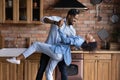 African 35s couple in love dancing in kitchen at home Royalty Free Stock Photo