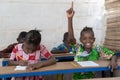 African School Children Raising Their Hands during Lesson Royalty Free Stock Photo
