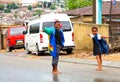 African school kids playing on a main road in Alexandra township, a formal and informal settlement