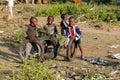 African poor children play with wheels on the street