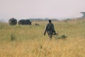 African soldier in military uniform patrols the territory Nairobi National Park in Kenya.