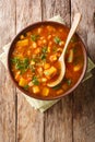 African spicy vegetarian sweet potato with lentil soup close-up in a bowl. Vertical top view Royalty Free Stock Photo