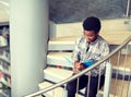 African student boy or man reading book at library Royalty Free Stock Photo
