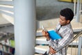 African student boy or man reading book at library Royalty Free Stock Photo