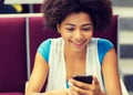 African student girl with smartphone on lecture Royalty Free Stock Photo